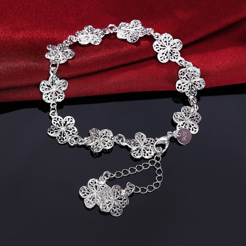 Bracelet en métal argenté en filigrane