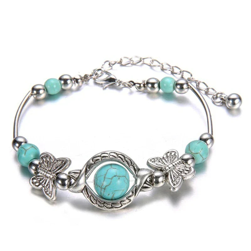 Bracelet avec des papillons et des perles turquoises