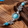 Bracelet avec des papillons et des perles turquoises