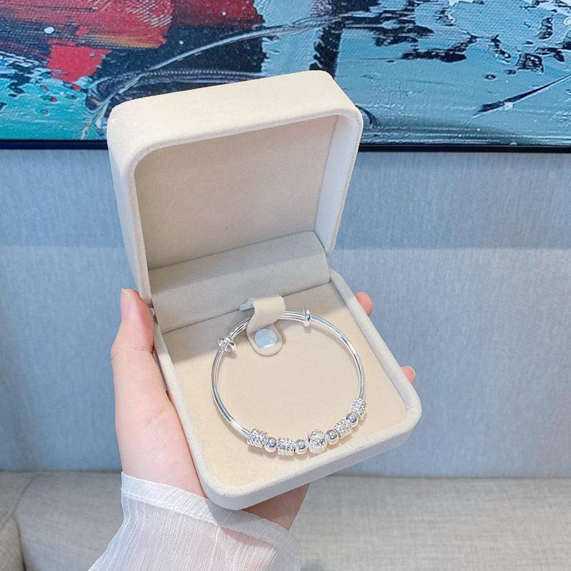Bracelet avec perles porte-bonheur en argent