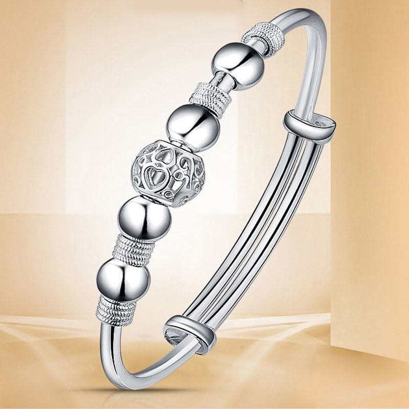 Bracelet avec perles porte-bonheur en argent