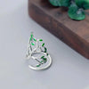 Bague en argent ajustable avec des feuilles vertes
