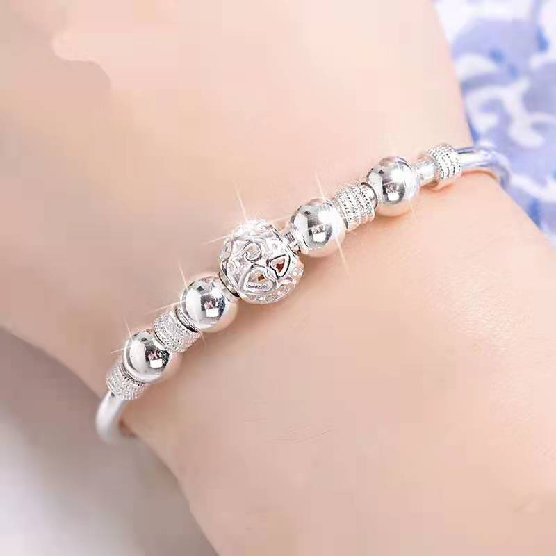 Bracelet avec perles porte-bonheur en argent