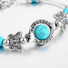 Bracelet avec des papillons et des perles turquoises