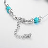Bracelet avec des papillons et des perles turquoises