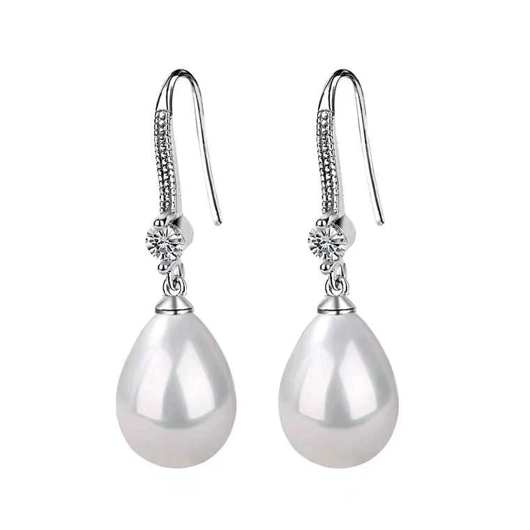 Boucles d'oreilles ovales blanches en perles