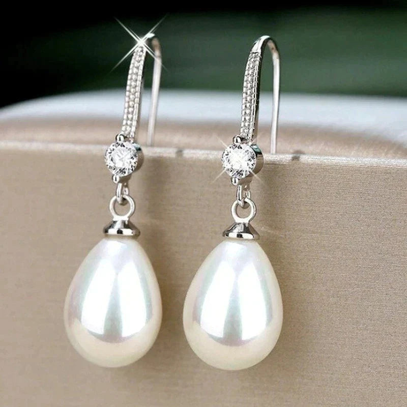 Boucles d'oreilles ovales blanches en perles