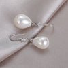 Boucles d'oreilles ovales blanches en perles