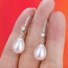 Boucles d'oreilles ovales blanches en perles