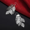 Boucles d'oreilles en filigrane superposées avec des feuilles