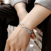 Bracelet ajustable avec plumes argentées