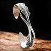 Bracelet ajustable avec plumes argentées