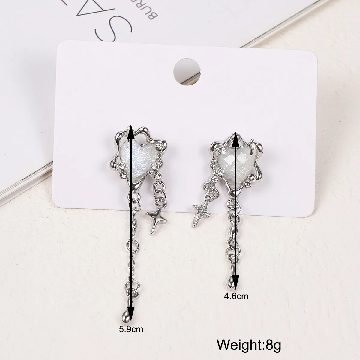 Boucles d'oreilles étoiles à pompons en forme de cœur irrégulier