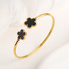 Bracelets clou et trèfle | Or & noir dans un design élégant