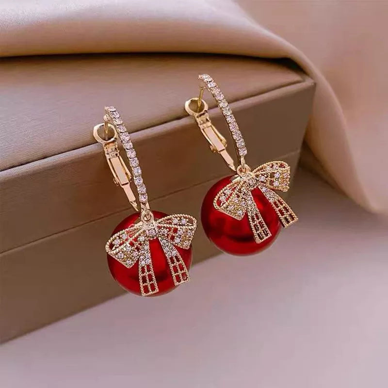 Boucles d'oreilles en perles et en nœuds de Noël