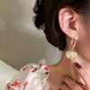 Boucles d'oreilles en perles et en nœuds de Noël