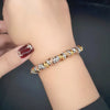 Bracelet chaîne perles dorées