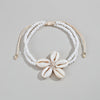 Bracelet de Cheville Bohémien avec Fleur en Coquillage - Accessoire Élégant pour l'Été et les Vacances