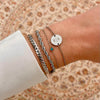Bracelet de naissance en pierres précieuses rondes