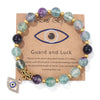 Bracelet en perles avec pendentif œil turc porte-bonheur
