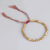 Bracelet en perles de cuivre porte-bonheur