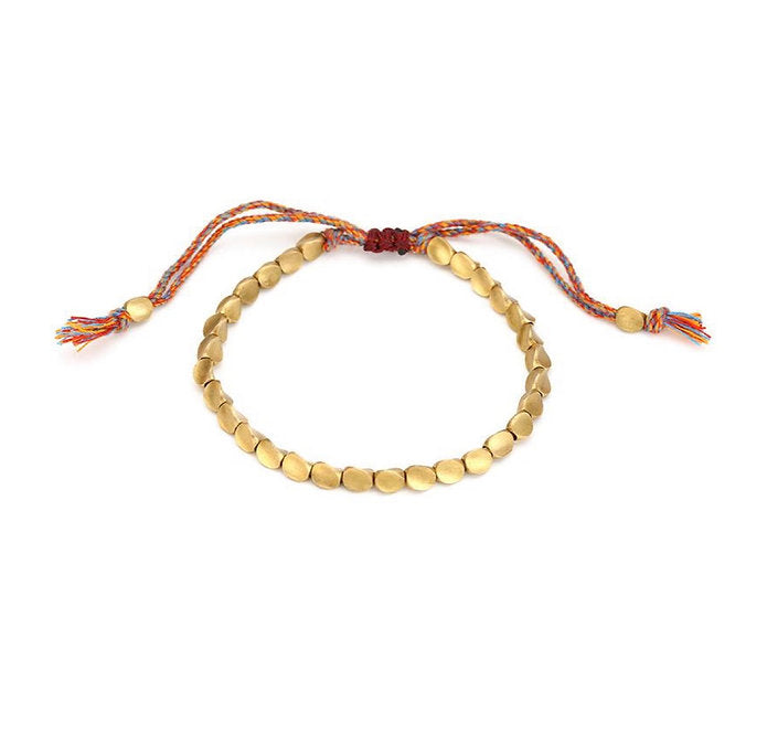 Bracelet en perles de cuivre porte-bonheur