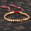 Bracelet en perles de cuivre porte-bonheur