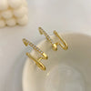 Boucles d'oreilles en forme de griffes en cristal