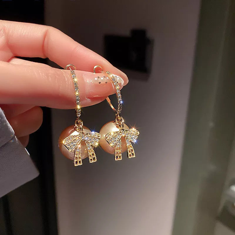 Boucles d'oreilles en perles et en nœuds de Noël