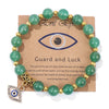 Bracelet en perles avec pendentif œil turc porte-bonheur