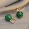 Boucles d'oreilles de luxe élégantes avec perles vertes