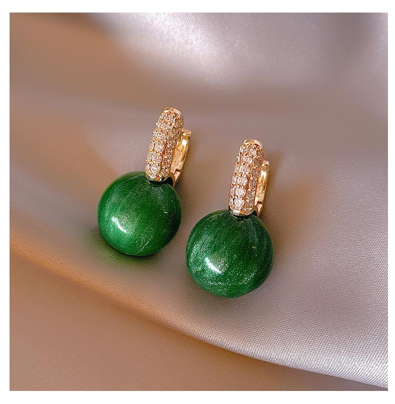 Boucles d'oreilles de luxe élégantes avec perles vertes
