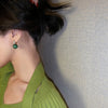 Boucles d'oreilles de luxe élégantes avec perles vertes