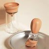 Bouteille en silicone avec tête de brosse - OilBuddy